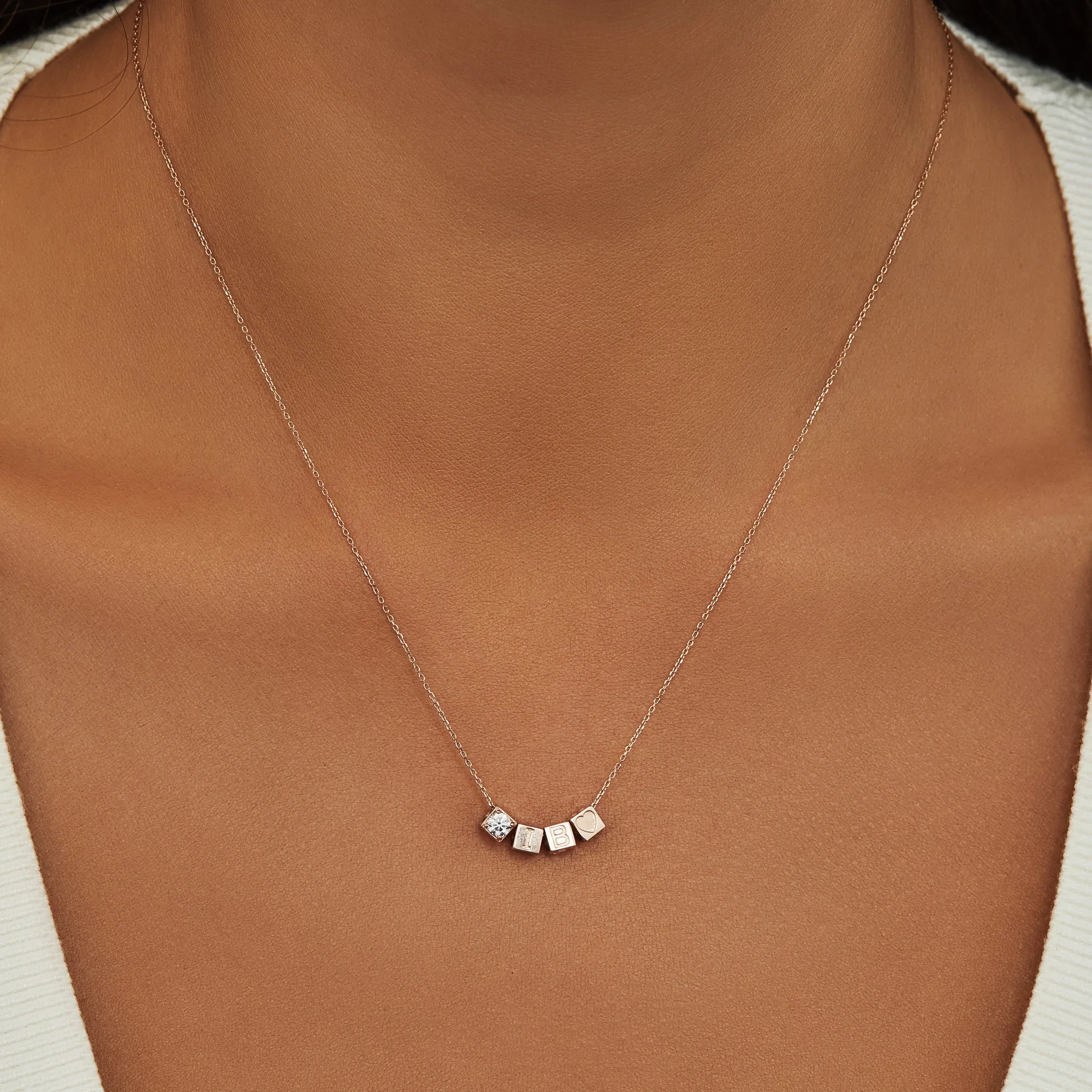 Cadeau d'Isabel 14 karat rose gold cube charm with heart and rose gold necklace gift set