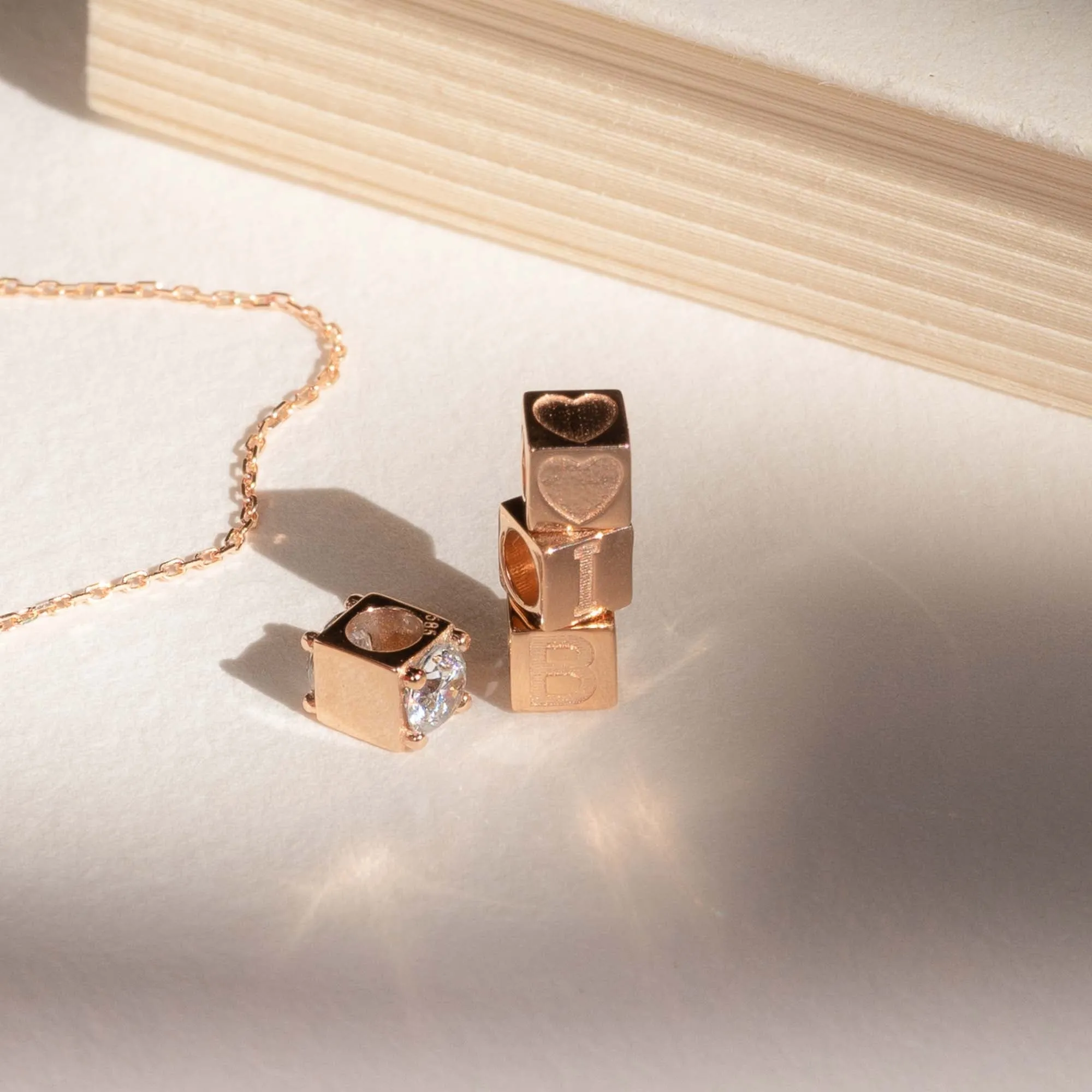 Cadeau d'Isabel 14 karat rose gold cube charm with heart and rose gold necklace gift set