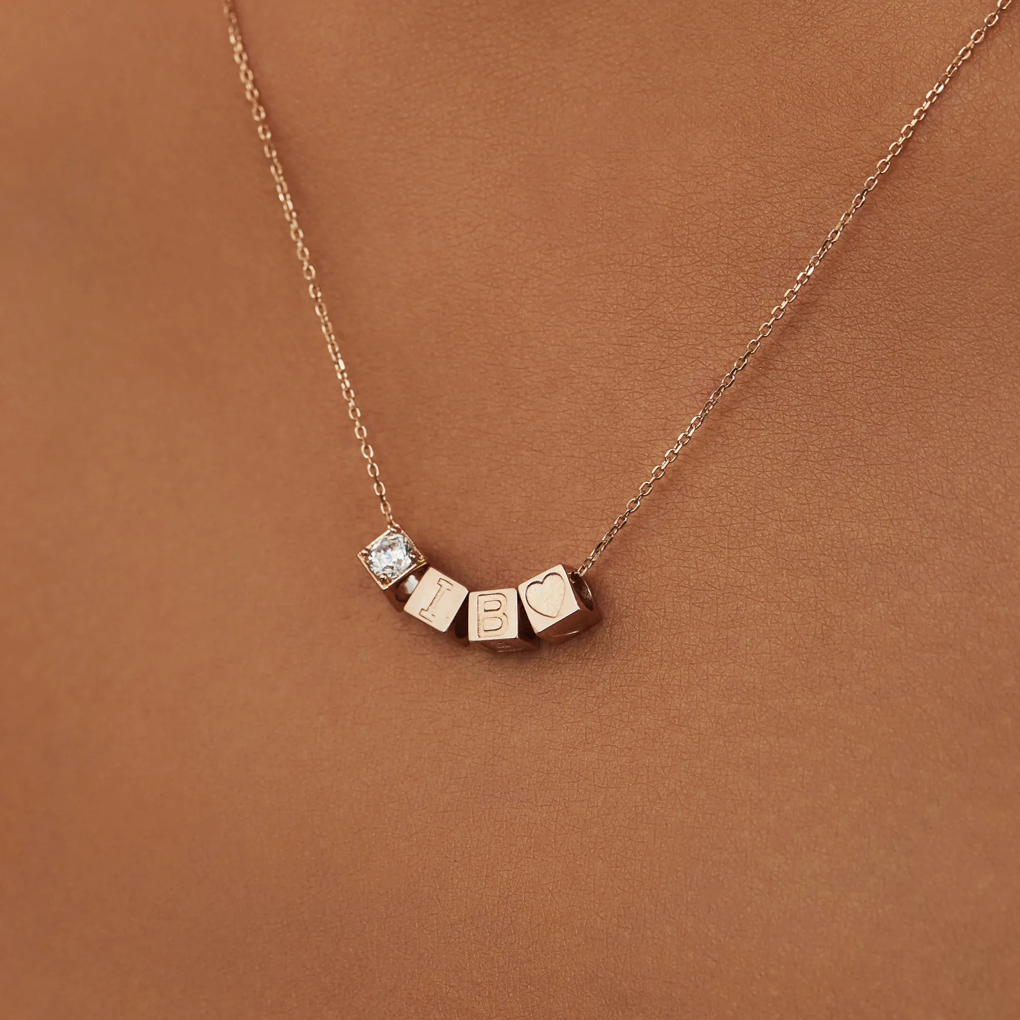 Cadeau d'Isabel 14 karat rose gold cube charm with heart and rose gold necklace gift set